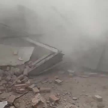 Witness nearly crushed to death by collapsing building