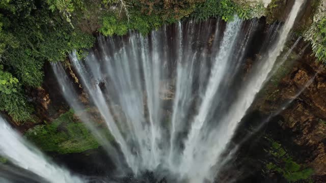 The waterfall flows in a deep forest, it sounds great