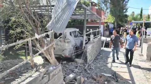 Footage from the site of a rocket impact in the Haifa area in the earlier Hezbollah barrage.