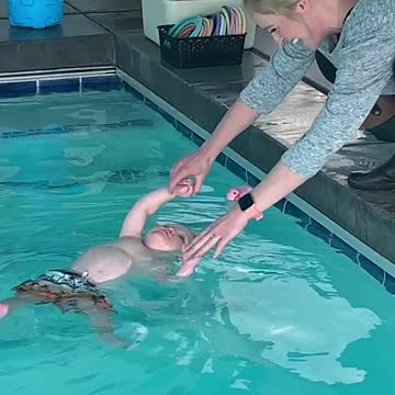 Child going in for toy with mom's help