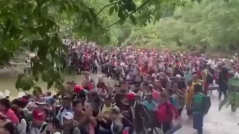 Huge horde of immigrants crossing the border towards the United States