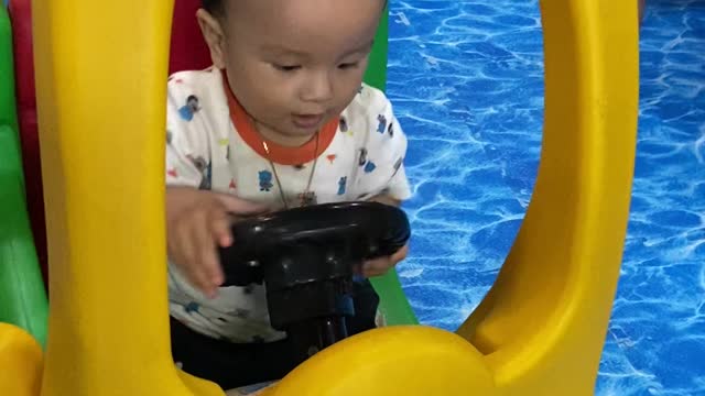 Baby son playground playing educational games