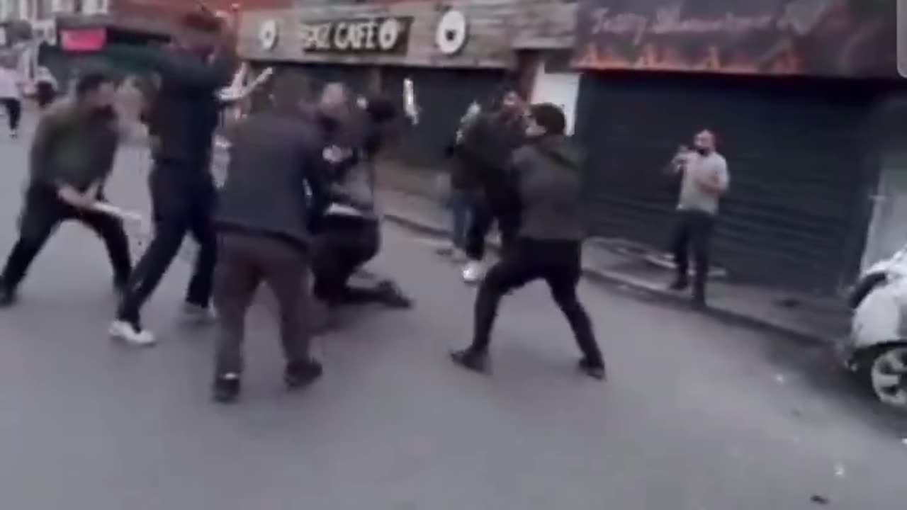 A lone white man is chased through the streets by Muslims and attacked with pieces of wood