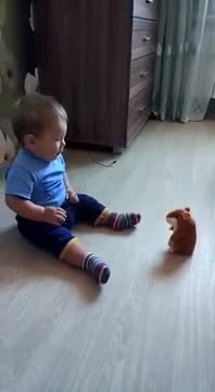 Adorable baby with hamster