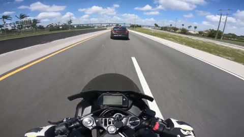 Police officer purposely slams on brakes for biker to crash into him on the highway