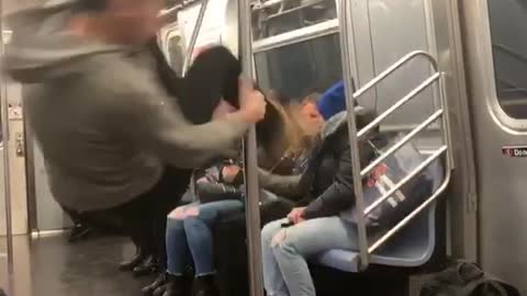 Woman in grey sweater spinning on pole