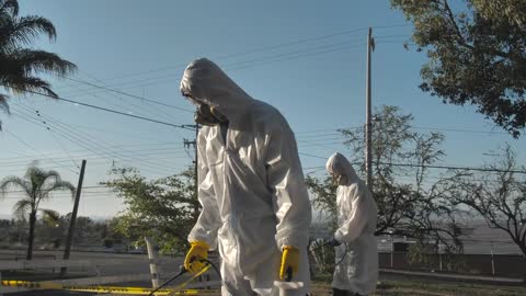 Health personnel disinfect common areas