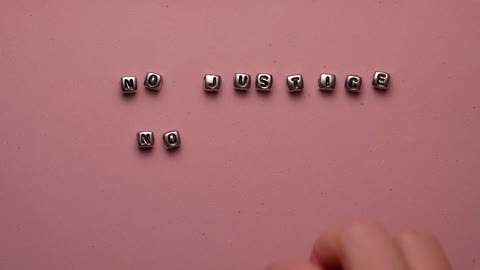 Person Spelling Words with Alphabet Beads