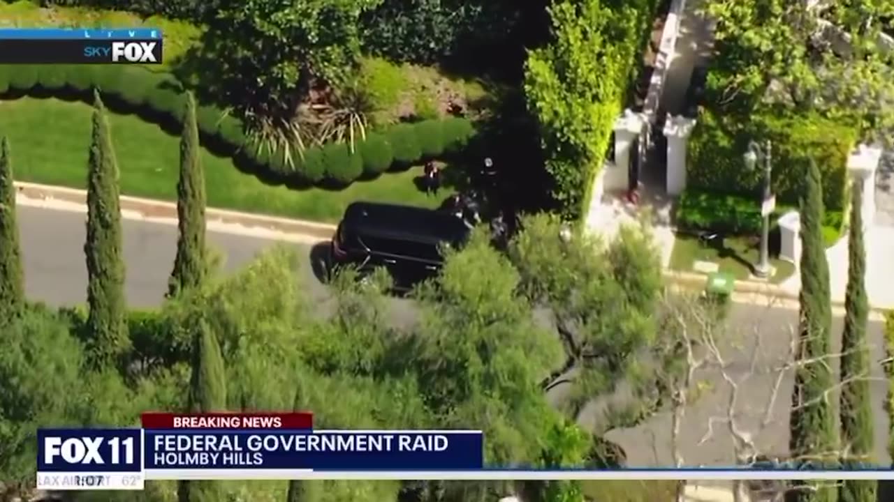 Federal agents have raided the home of American rapper and record producer