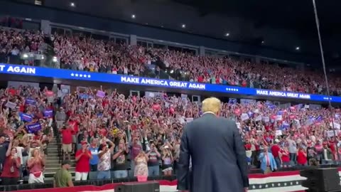 President Donald Trump taking the stage in Grand Rapids, MI