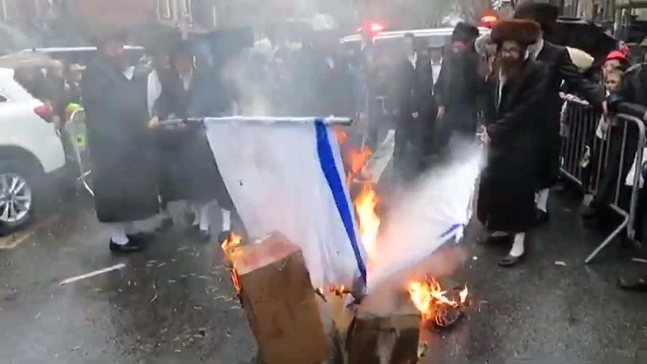 Orthodox Jews Burning the Zionist Israeli flag in Williamsburg, Brooklyn, New York.