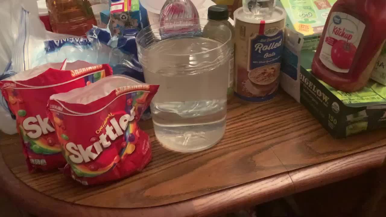 I pour Skittles in a bucket of water