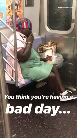 Think youre having a bad day lady green dress smoking subway