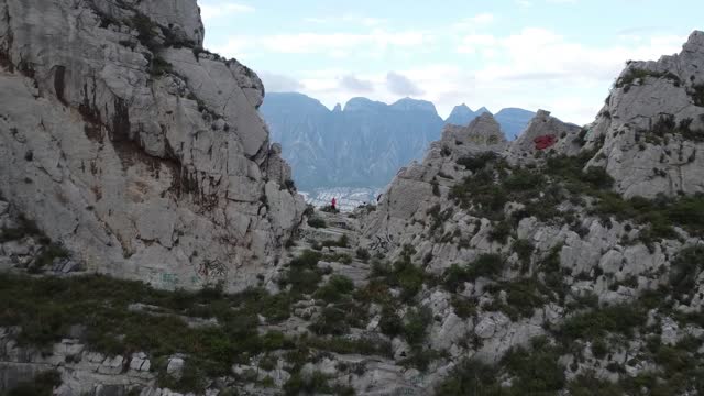 "Goosebumps" Guaranteed when Drone captures Astounding footage of Girl standing on Mountain Cliff