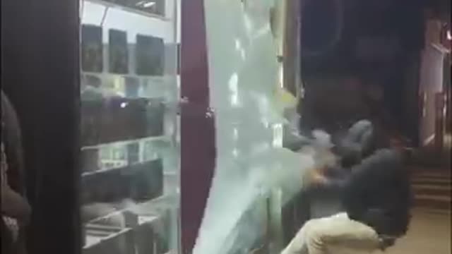 Crazy guy , broke the glass door of the store