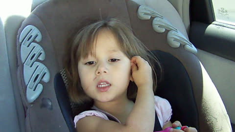 Singing from the car seat.