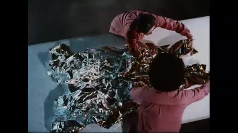 Clip from Moonwalk One ca 1970 Space Suit