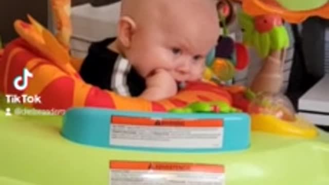 Tired baby literally falls asleep while bouncing in jumper