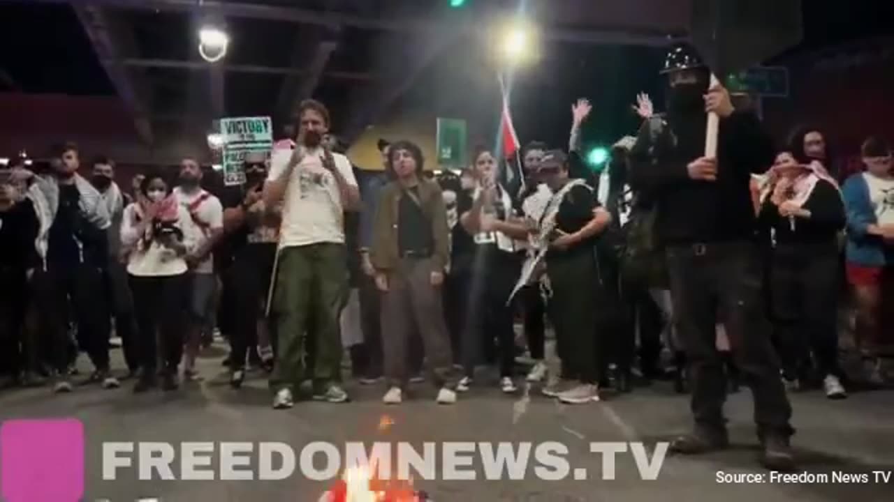 WATCH: Protesters Outside Chicago DNC Torch American Flag, Shout “F*ck America”