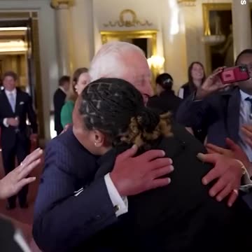 : King Charles beams as he gets group hug from Black Ferns rugby team