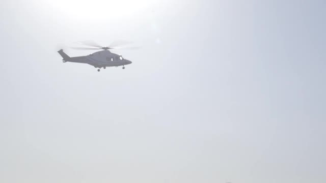 A Helicopter On Flight Leaving An Airfield