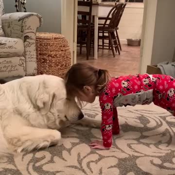 Little Girl Sweetly Bonds With Adorable Pup