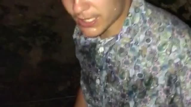 Guy in paisley shirt cracks beer over head and chugs it
