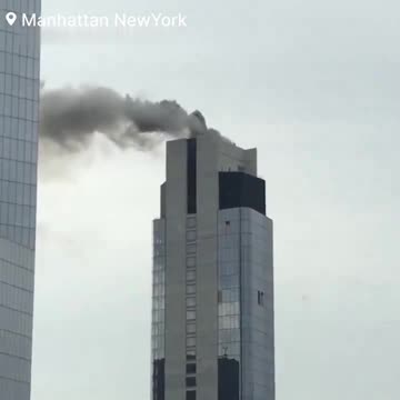 🚨#BREAKING: Heavy Smoke and Flames Spotted Near World Trade Center Following High-Rise Rooftop Fire