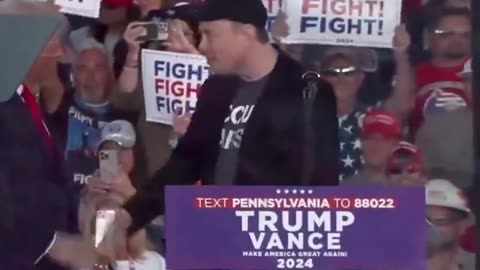 ELON MUSK speaks at a TRUMP rally