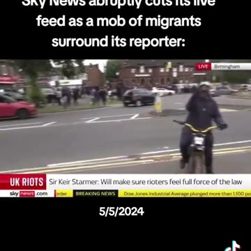 Sky News abruptly cuts its live feed as a mob of migrants surround its reporter