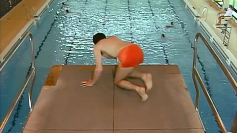 Mr Bean displays swimming and diving skills at the pool.