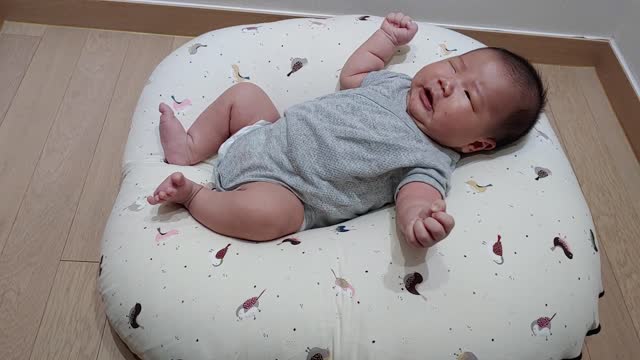 The baby's yawning.