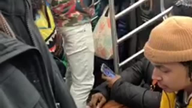 Guy raps out loud on subway train and everyone is pissed