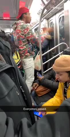 Guy raps out loud on subway train and everyone is pissed