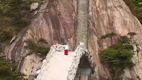 A small bridge connects two mountains