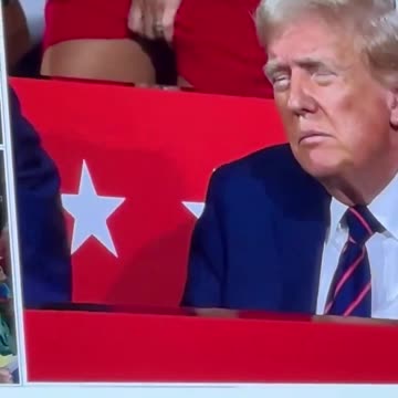 Ok, WTF is this chick doing behind Trump??