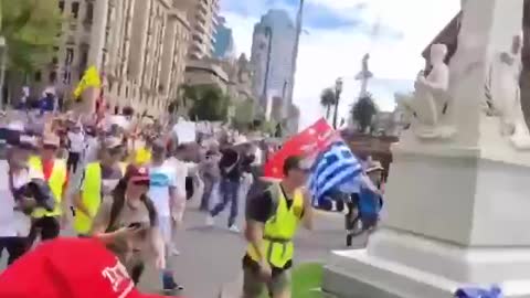 Protests screaming Arrest Dan Adnrew's down the streets of Melbourne Australia