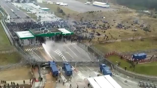 Border of Poland with Belarus, disperse migrants with a water cannon