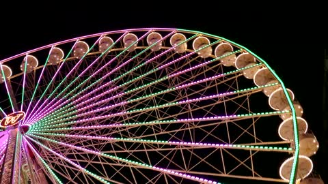 Colorful Ferris Wheel in Motion