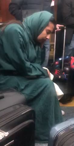 Woman falling asleep on bumpy subway train