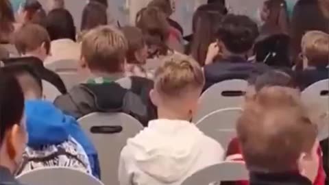 Young white German school kids forced to listen to a muslim sing to ALLAH