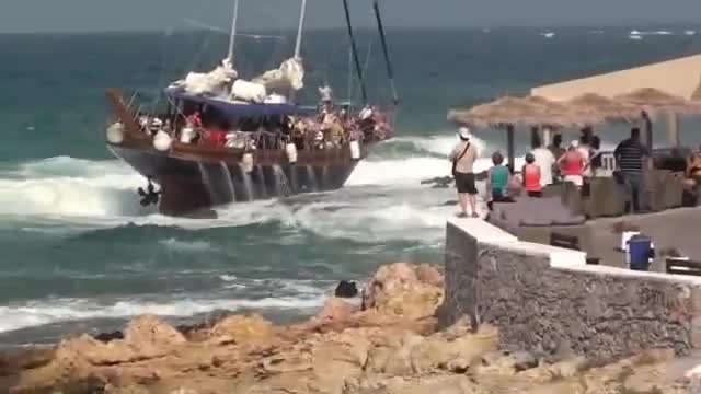 A BOAT CRUSH IN ROCKS IN CRETE