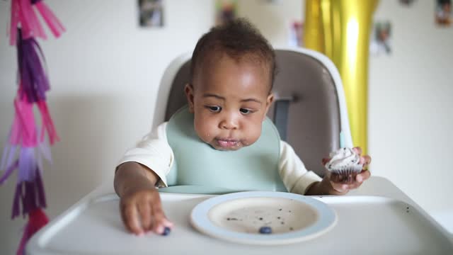 Baby was eating his cake alone