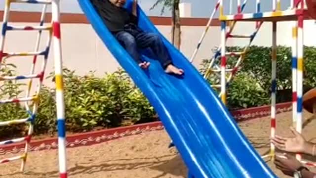 Cute boy sliding