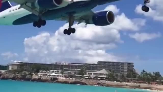 Watching the plane landing near a beach is unbelievable