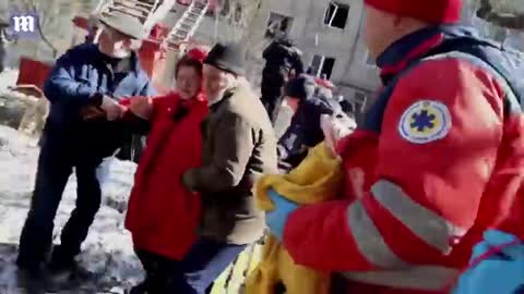 Kharkiv residents run as Russian jets fly over bombed house