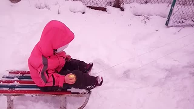 Sledding our daughter