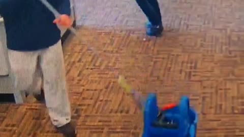 Woman Fights Janitor Catches Mop To Face