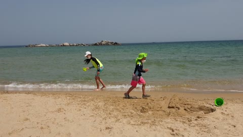 beach children playing in the sand