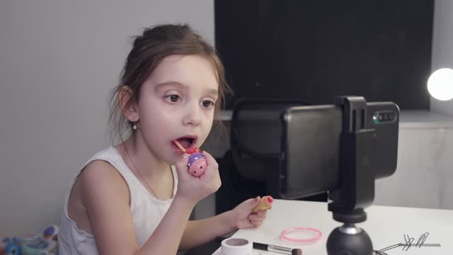 Cute little girl doing makeup!!!